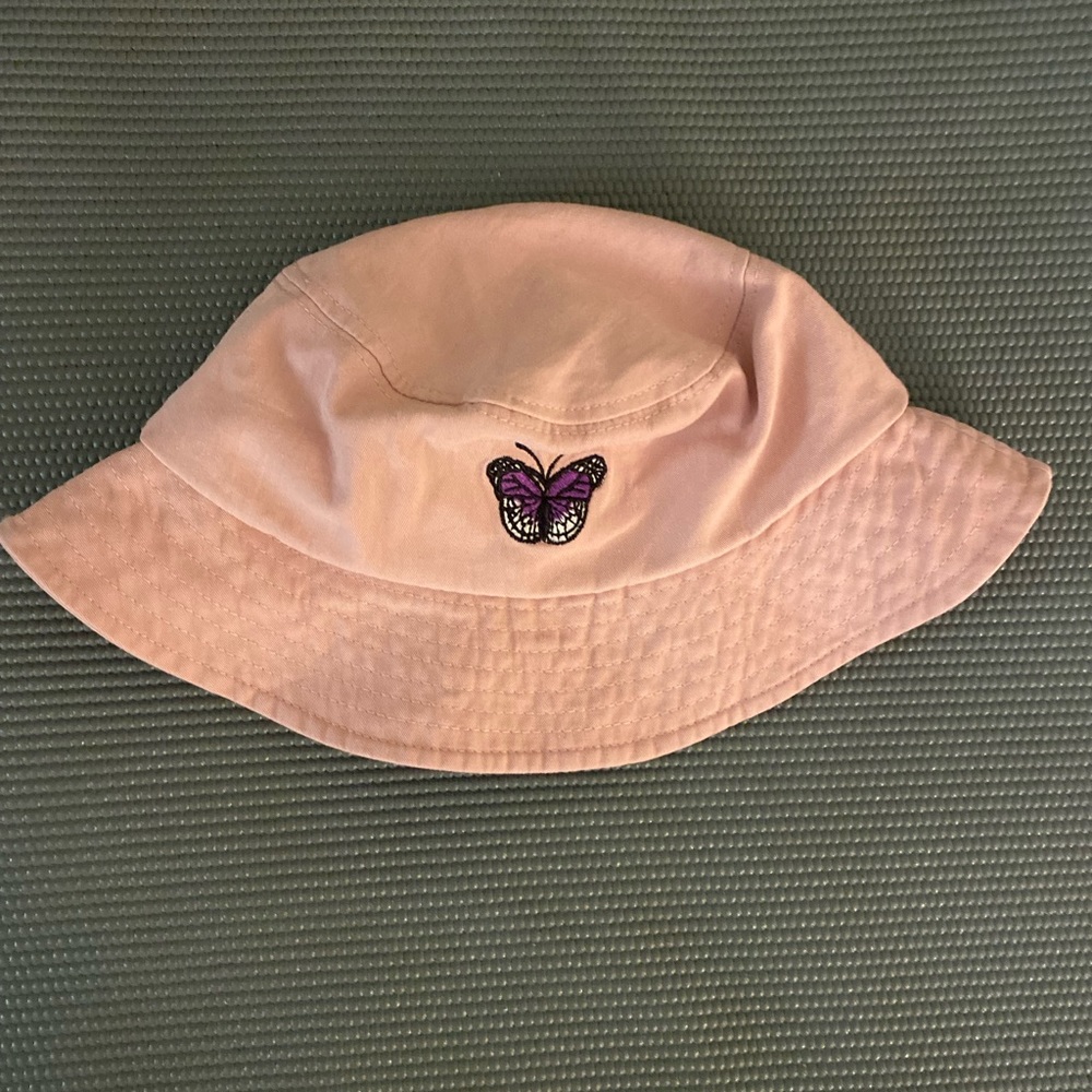 Light pink bucket hat with butterfly decal